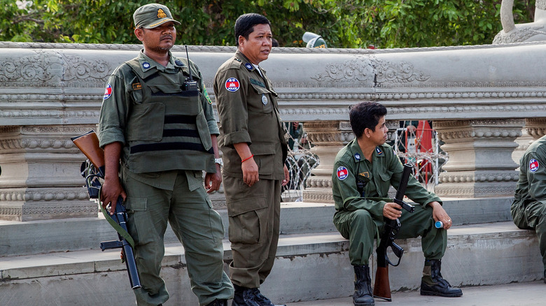 Police hold tear gas guns