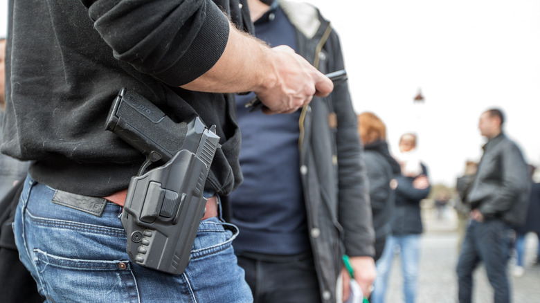 Police carrying gun French protest