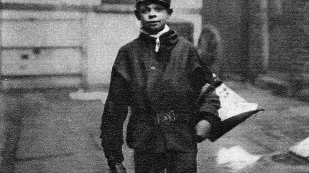 A street-scavenger, armed with brush and scoop to collect horse manure off the streets