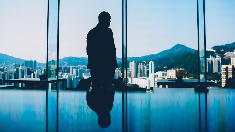 man staring out a window