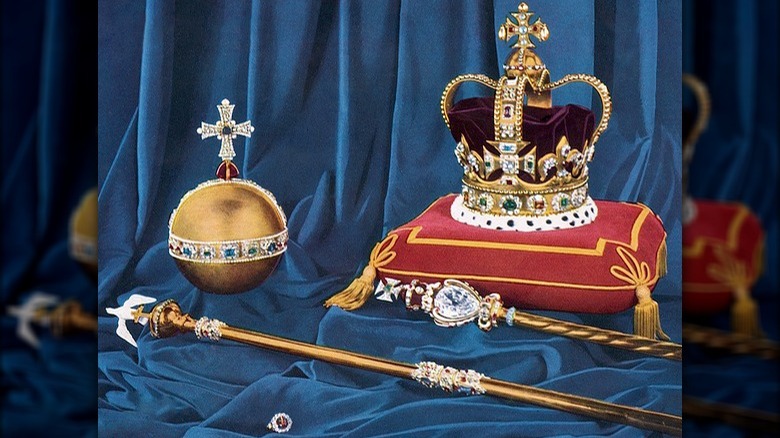 English crown jewels resting on blue cloth