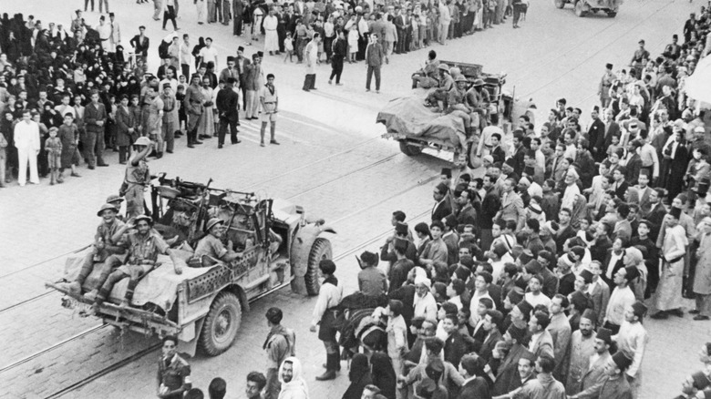 French troops and jeep damascus pass crowds 1941