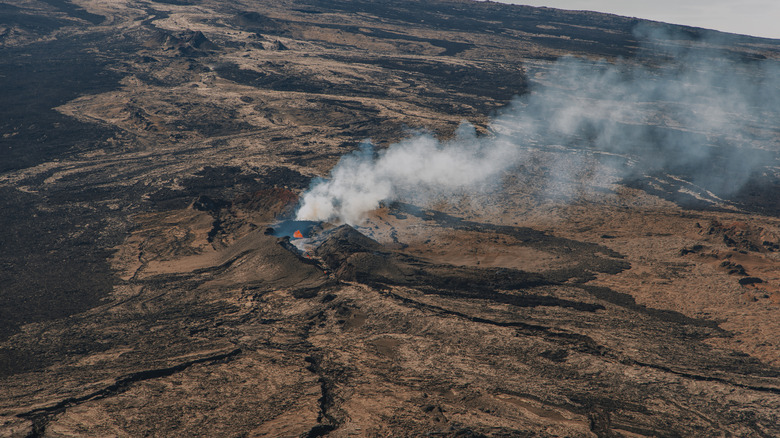 aerial view of  erupting Mauna Loa with smoke