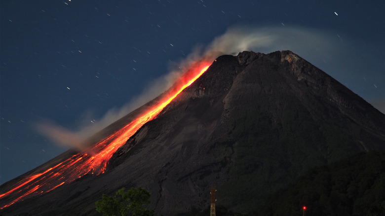 Mount Merapi with lava running down the side