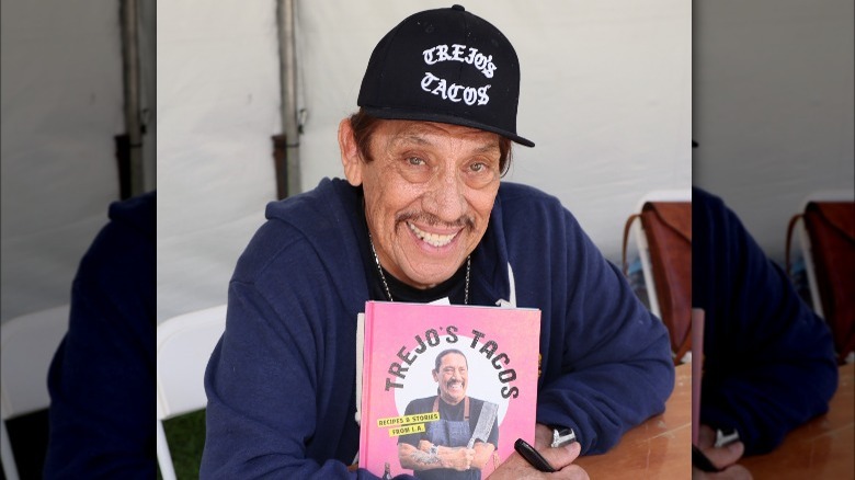 Trejo in a Trejo's Tacos cap