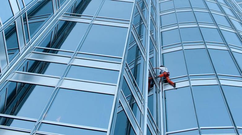 climber Alain Robert on side of building