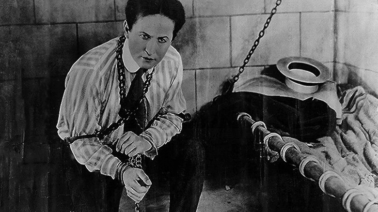 Harry Houdini wearing chains