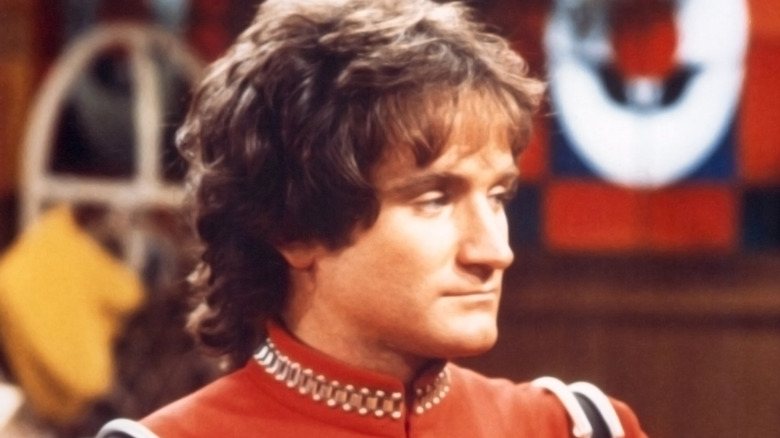 Robin Williams as Mork