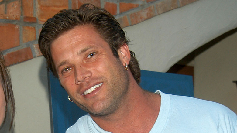 Sasha Mitchell smiling