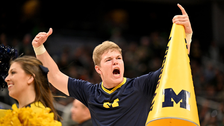 A Michigan cheerleader yells