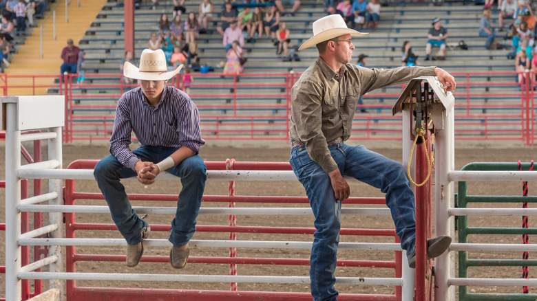 Men in rodeo audience 