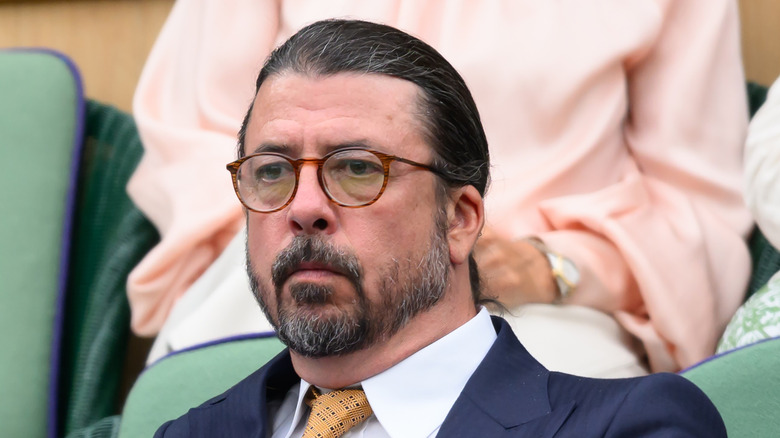 Dave Grohl watching a tennis match while attending Wimbledon in July 2024