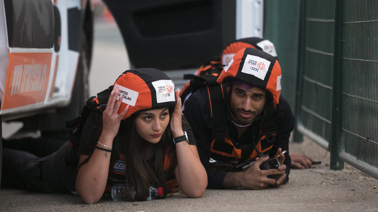 Man and woman protective gear lying 