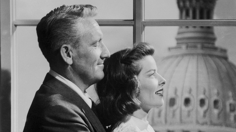 Spencer tracy standing behind Katharine Hepburn