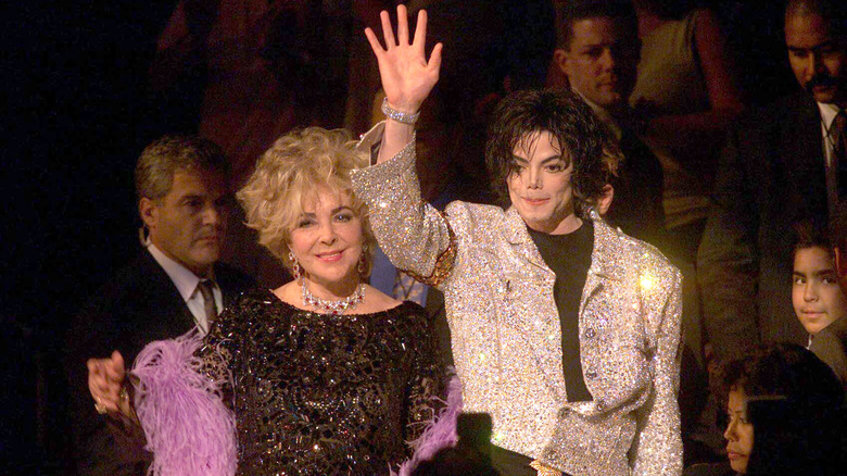 Elizabeth Taylor with Michael Jackson waving