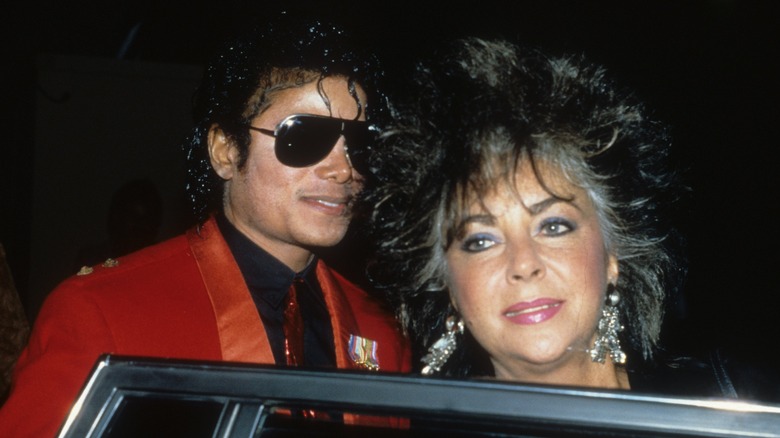 Elizabeth Taylor and Michael Jackson near car