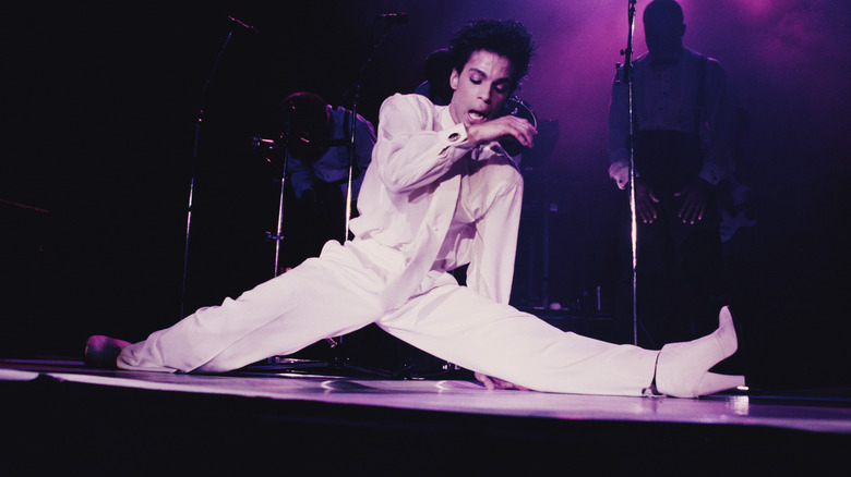 Prince white suit doing splits on stage