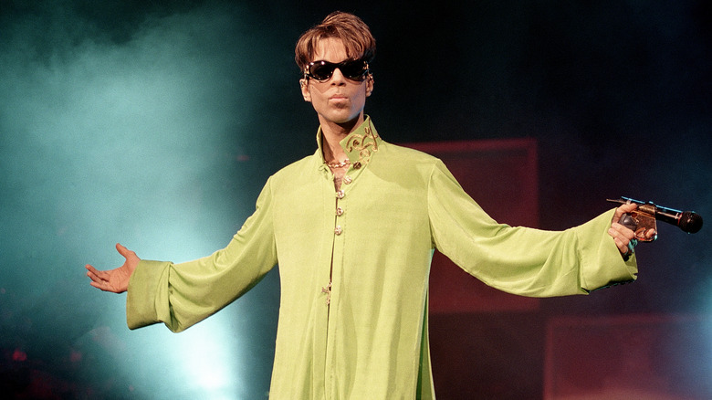 Prince sunglasses green shirt sunglasses on stage