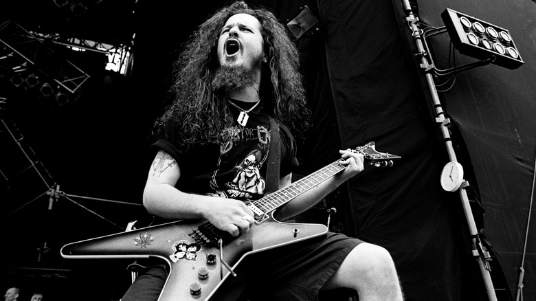 Dimebag Darrell playing guitar mouth open