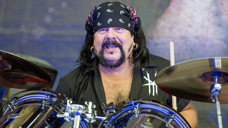 Vinnie Paul Abbott playing drums smiling