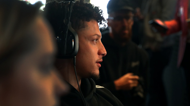 Patrick Mahomes wearing headphones playing Call of Duty