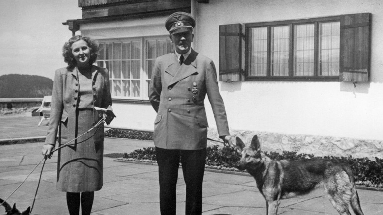 Eva Braun with Hitler and dogs