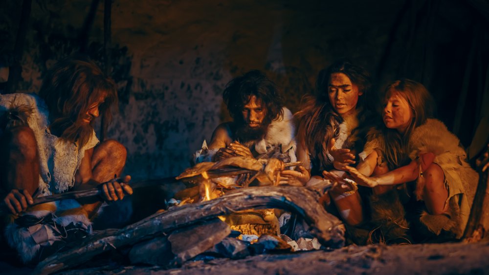 Prehistoric family cooking supper