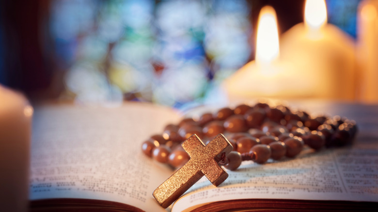 Rosary, Bible, and candles