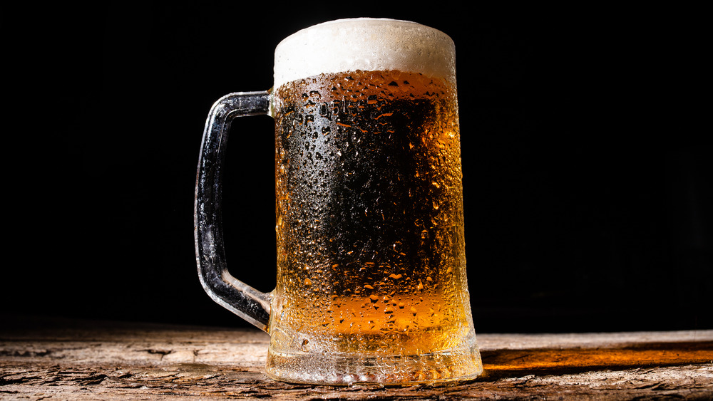 A glass mug of cold beer