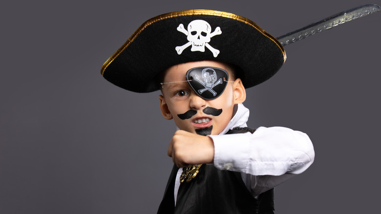 a child cosplaying as a pirate