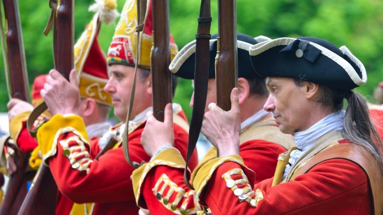 English redcoat reenactors with muskets