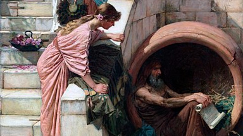 woman watches Diogenes in barrel