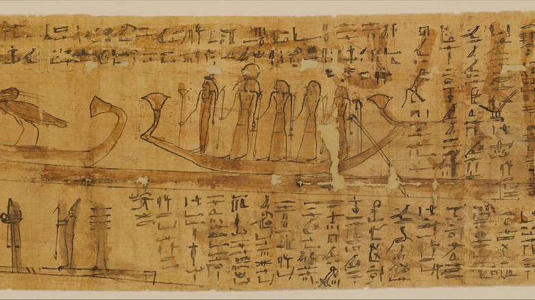 Ancient Egyptian papyrus people on boats hieroglyphics 