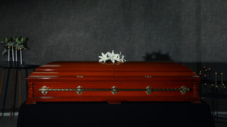 casket with white flowers