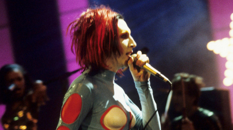 Marilyn Manson onstage in latex jumpsuit