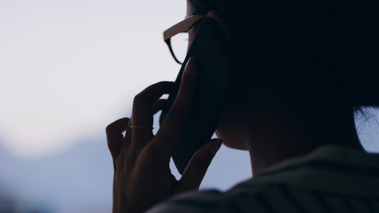 silhouette of a woman on the phone