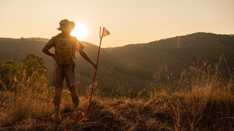 unidentifiable scout holding a flag