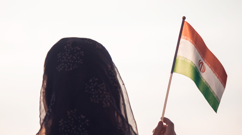 woman headscarf and Iranian flag 