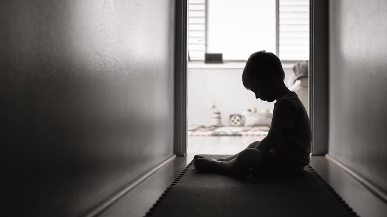 Silhouette of child in hallway