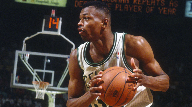 Reggie Lewis looks to shoot a three