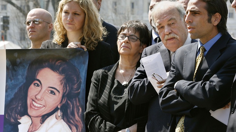 painting of terri schiavo held by her family