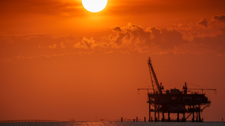 Offshore oil rig at sunset