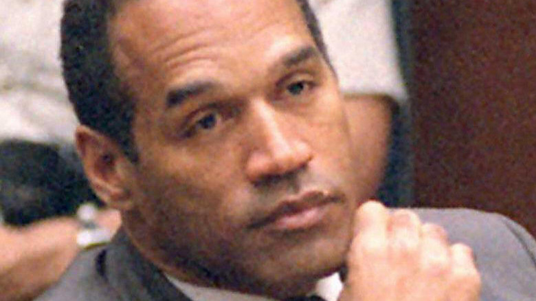 O.J. Simpson hand to chin