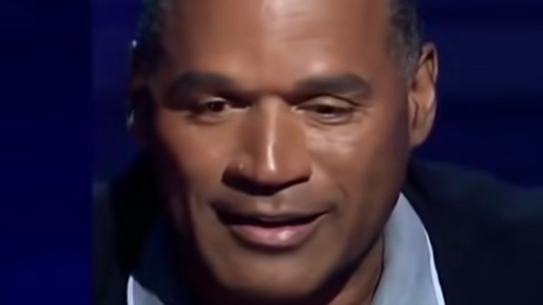 O.J. Simpson looking down smiling
