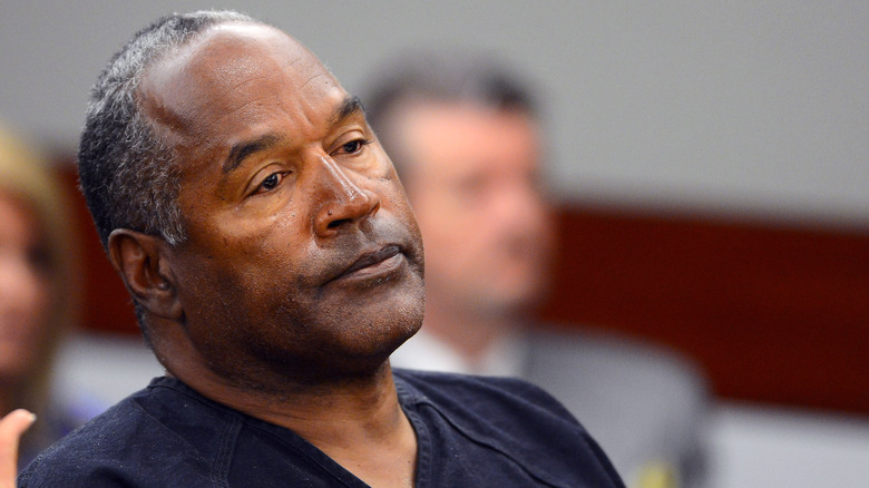 O.J. Simpson looks down head tilted