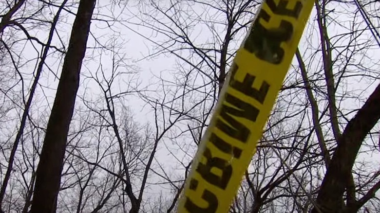 crime scene tape in woods