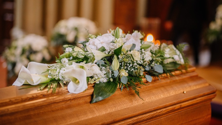 coffin with flowers on