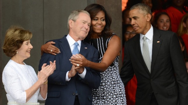 Michelle Obama hugs George W Bush