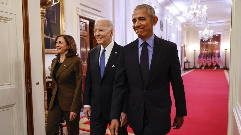 Harris, Biden, and Obama walk together