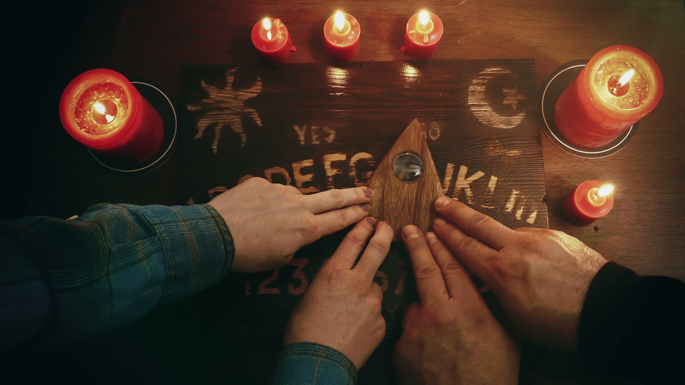 Hands on a Ouija board